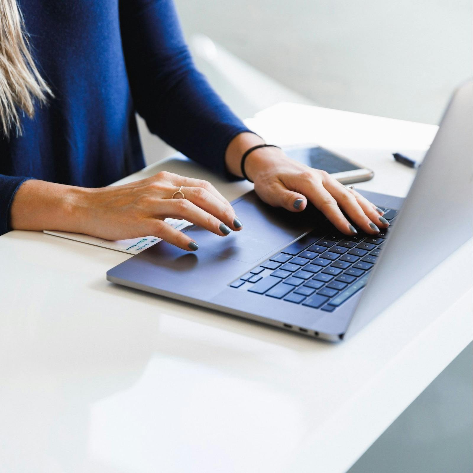 Stock image_Woman typing on computer_Rectang