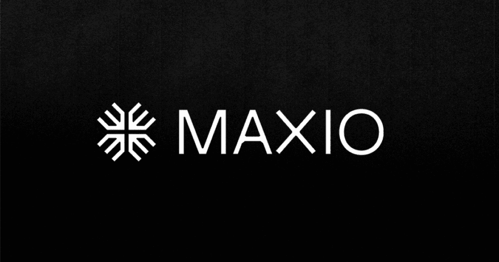 A black background with a white geometric snowflake-like symbol followed by the text "MAXIO" in bold, uppercase letters.
