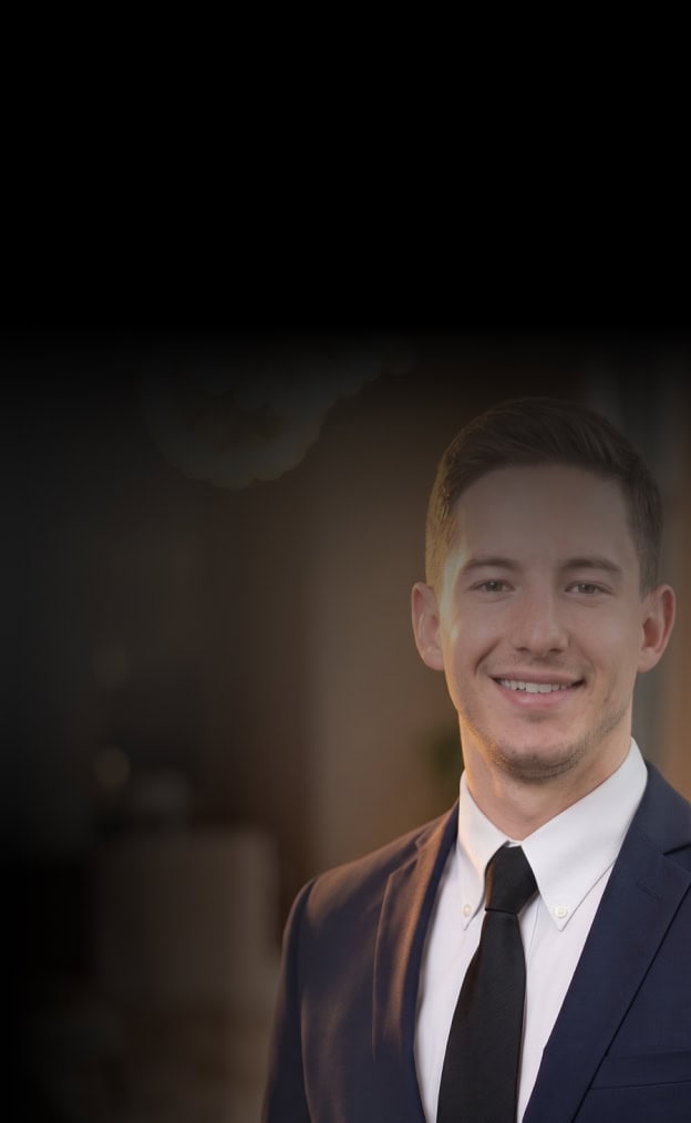 Business professional smiling in a modern office setting.