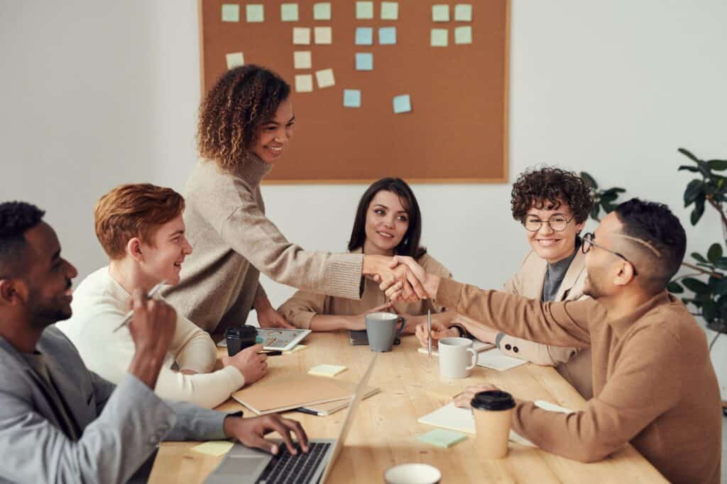 Business team discussing revenue-based financing options in a meeting.