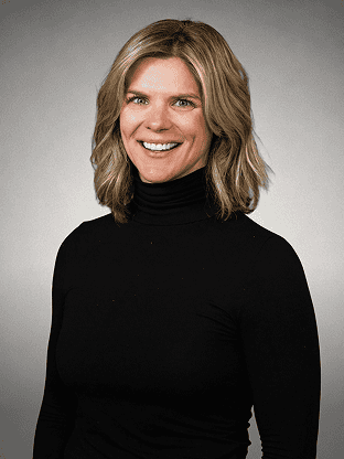 Professional woman smiling, wearing a black turtleneck, about us page image.